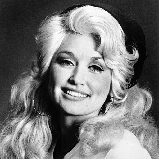 Smiling Dolly Parton with long blonde hair poses for a classic portrait.