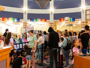 A group of families at the Georgetown Branch in line to receive a free backpack from Blessings in a Backpack
